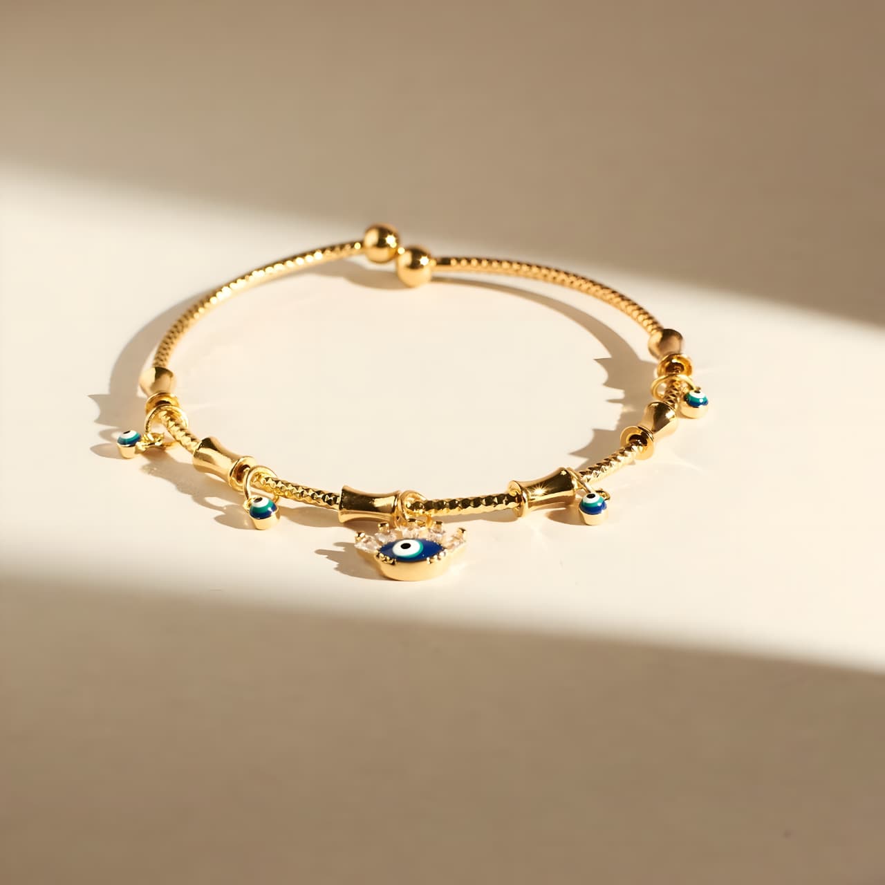 Chic Evil Eye Tassel Bangle by Gleamy