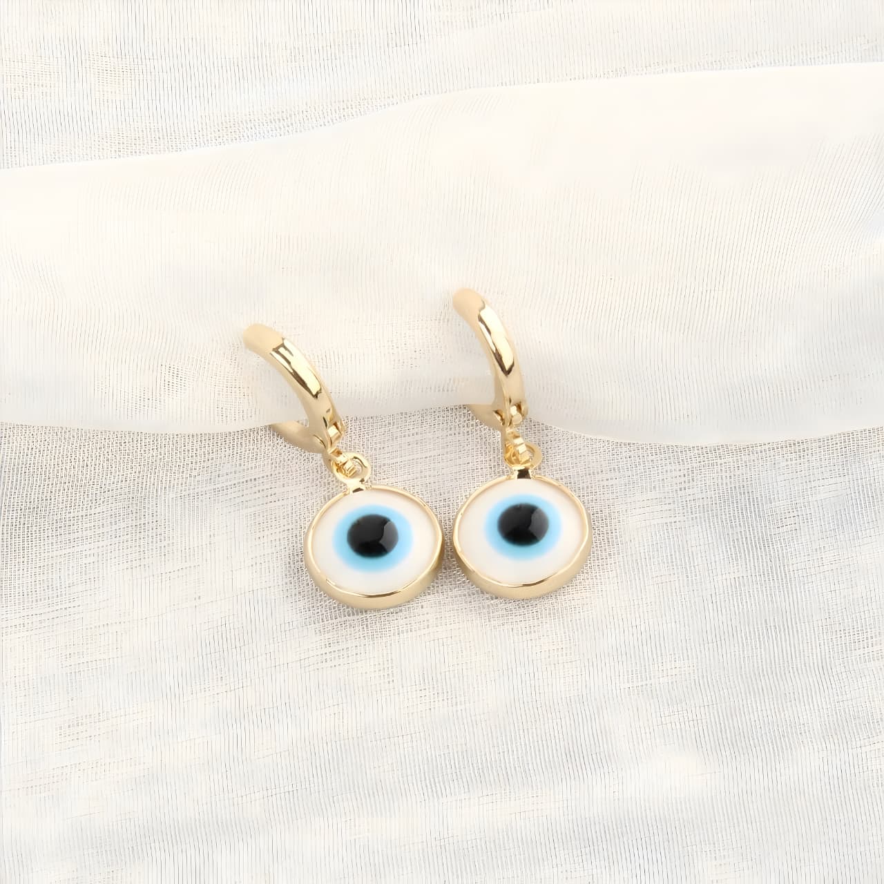 Evil Eyes Gold Brim Wind Drop Earrings - Light Blue by Gleamy